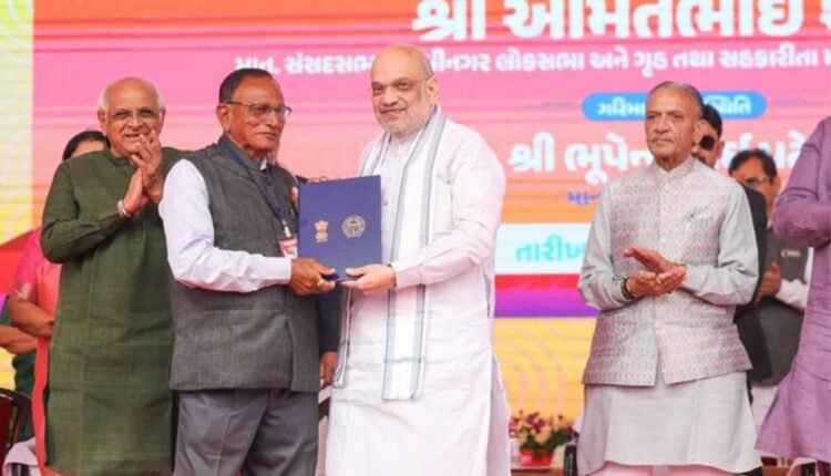 Amit Shah distributes land allotment certificates in Ahmedabad