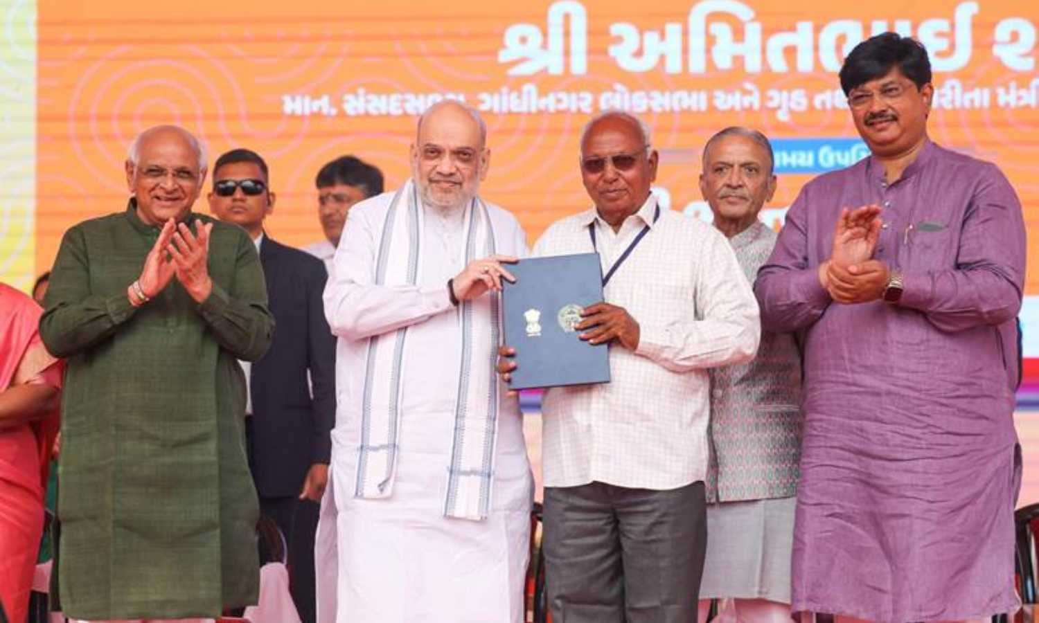Amit Shah distributes land allotment certificates in Ahmedabad